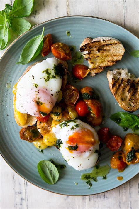sauteed-tomato-breakfast-crostini-with-poached-eggs image