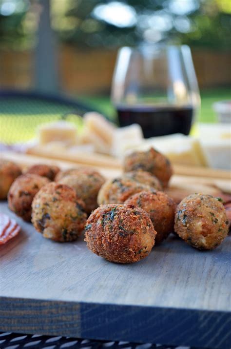 fried-olives-stuffed-with-italian-sausage-and-goat-cheese image