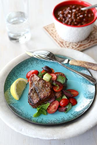 greek-grilled-lamb-chops-recipe-with-tomato-cucumber-salad image