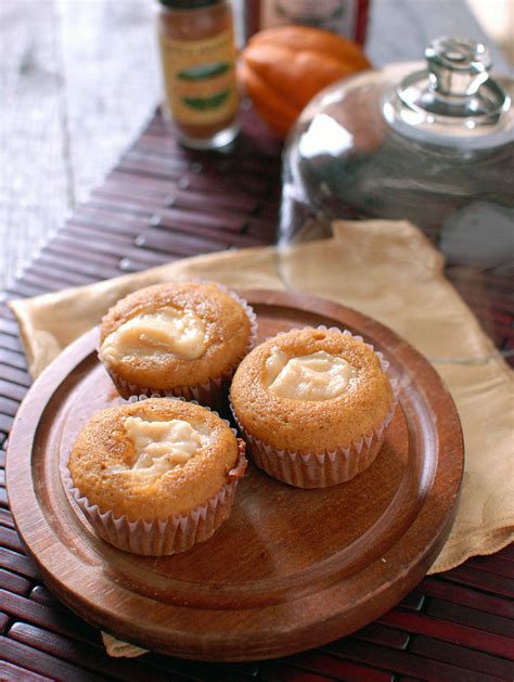 pumpkin-cupcakes-w-molasses-cream-cheese-filling image