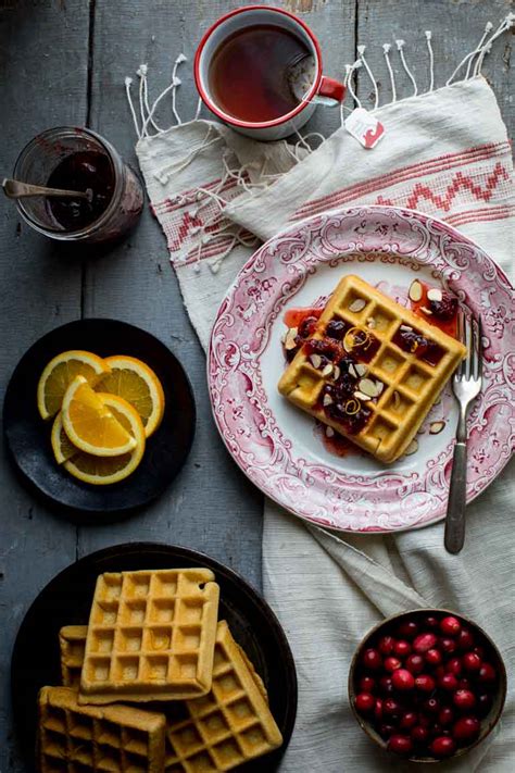 almond-waffles-with-cranberry-orange-honey-syrup image