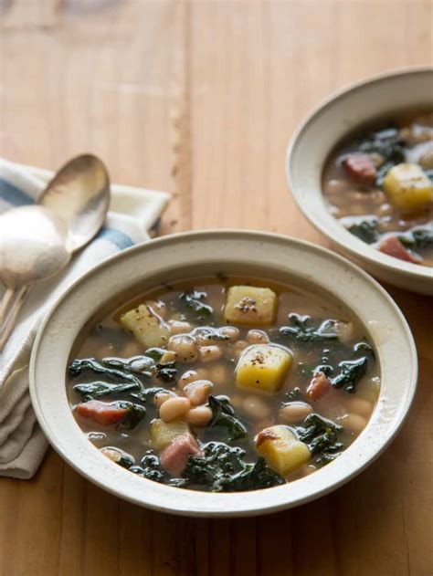 hearty-white-bean-and-kale-soup-spoon-fork-bacon image