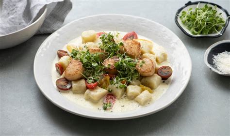 gnocchi-with-seared-scallops-in-cream-sauce-bobby-berk image