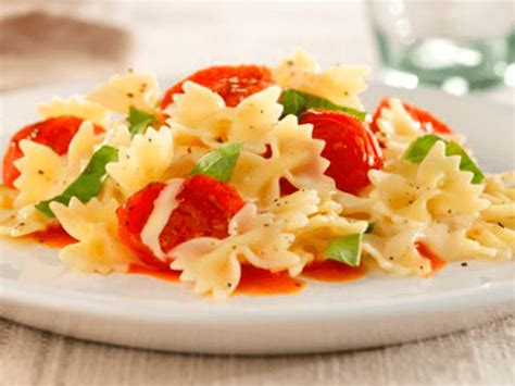 mini-farfalle-pasta-with-cherry-tomatoes-basil image