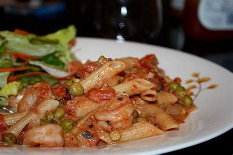 pasta-with-creamy-shrimp-tomatoes-and-peas image