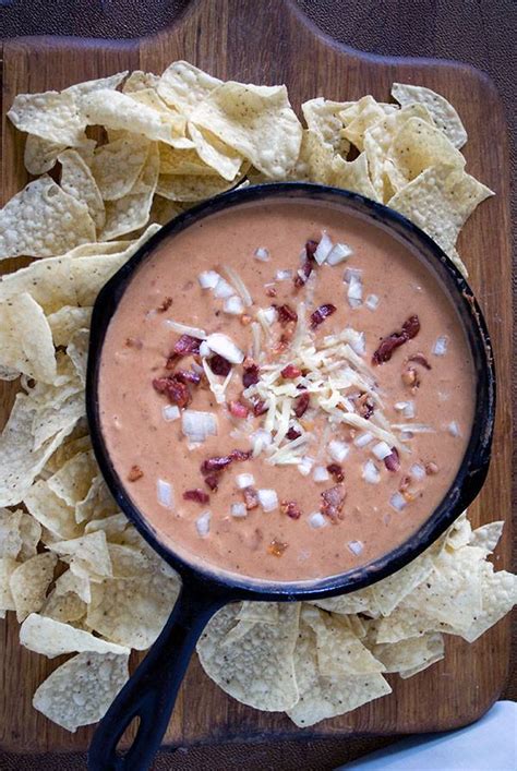 bean-and-bacon-dip-with-salsa-sour-cream-and-cheddar image