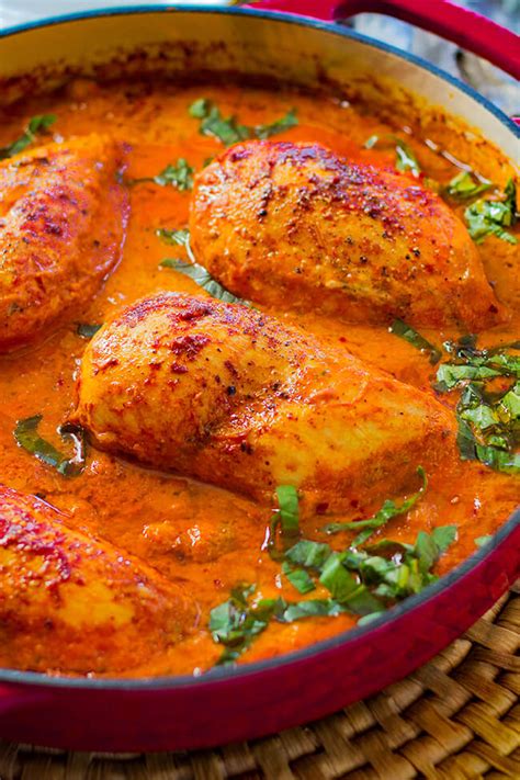 creamy-roasted-red-pepper-chicken-skillet-cooking image