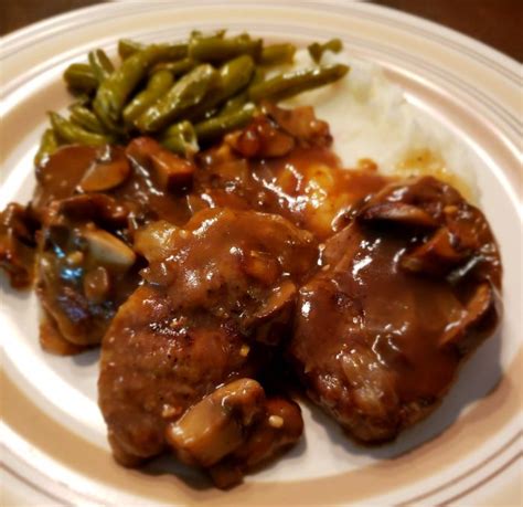 smothered-venison-steaks-with-mushrooms-onions image