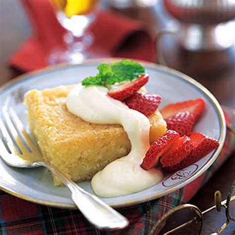 lemon-syrup-cake-with-berries-and-lemon-curd-cream image