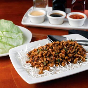 what-goes-into-pf-changs-ever-popular-chicken-lettuce-wraps image