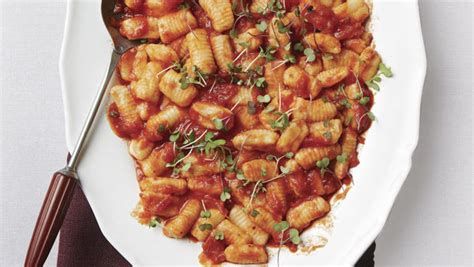 potato-ricotta-gnocchi-with-marinara-sauce-and-basil image