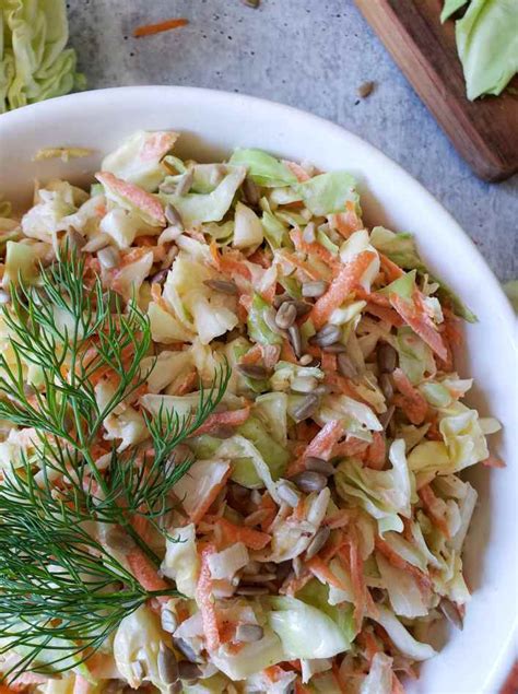 tangy-coleslaw-recipe-with-sunflower-seeds-optional image