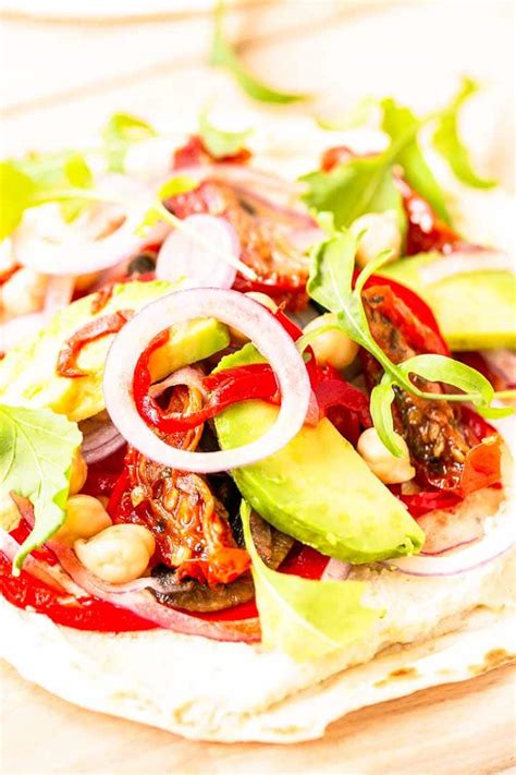 how-to-make-a-hummus-veggie-wrap-the-tortilla image