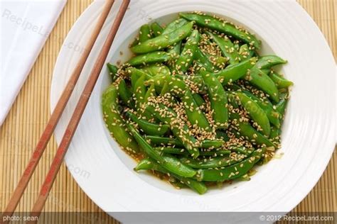sugar-snap-peas-with-orange-sesame-asian-dressing-recipeland image