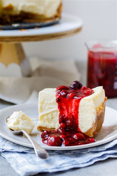classic-lemon-cheesecake-with-easy-berry-sauce-simply image