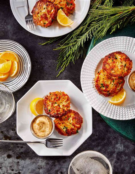 crab-cake-bites-with-old-bay-mayo-chives-and-lemon image