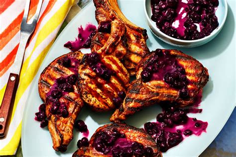 grilled-pork-chops-with-burst-blueberry-sauce-recipe-food-wine image
