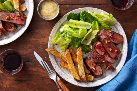 seared-steaks-garlic-butter-with-oven-fries-blue image
