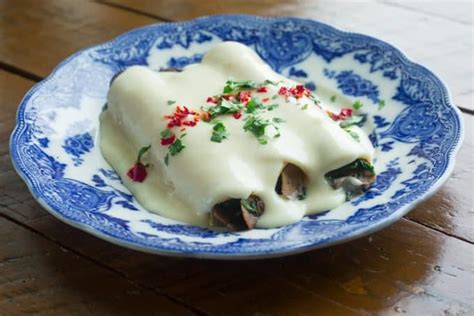 spinach-and-mushroom-enchiladas-with-cream-sauce image
