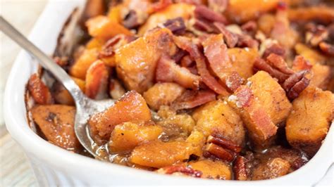 best-maple-candied-yams-recipe-topped-with-pecans image
