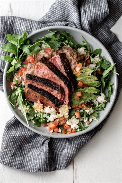 seared-steak-with-refried-pinto-beans-crispy-rice-and image