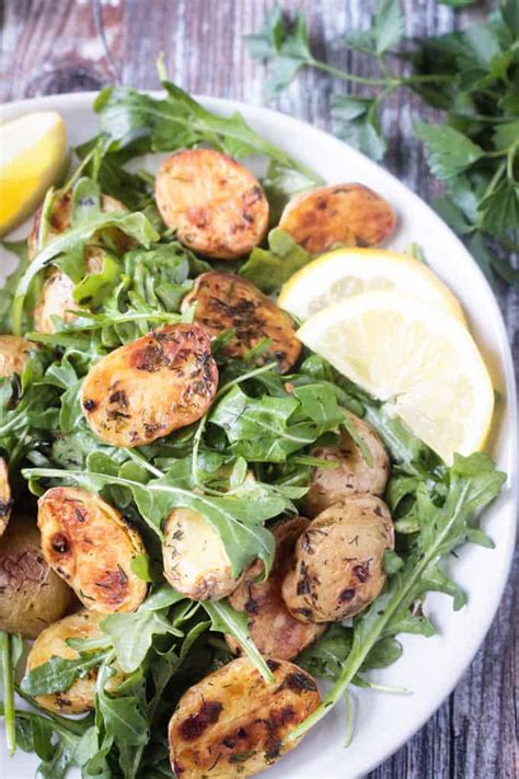 arugula-salad-with-roasted-potatoes-veggie-inspired image
