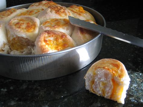 sourdough-cheddar-rolls-she-makes-and-bakes image