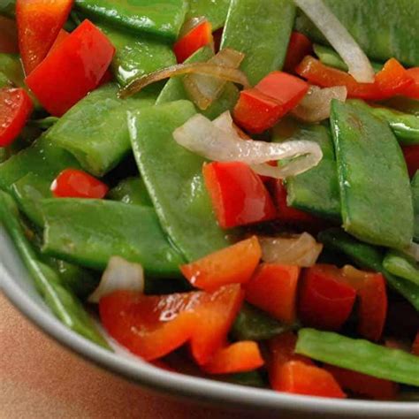 stir-fried-snow-peas-red-pepper-and-shallots image
