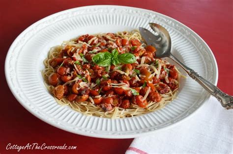 roasted-balsamic-cherry-tomatoes-over-angel-hair-pasta image
