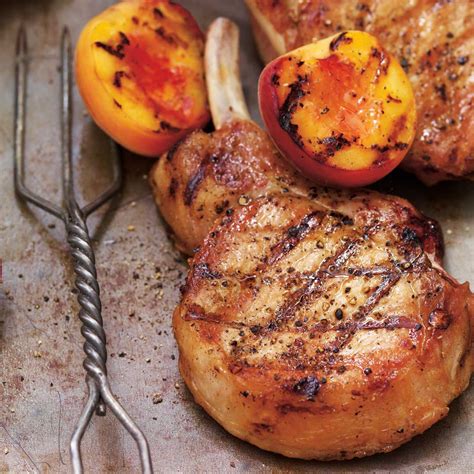 grilled-pork-chops-with-herbed-cheese-and-grilled-peaches image