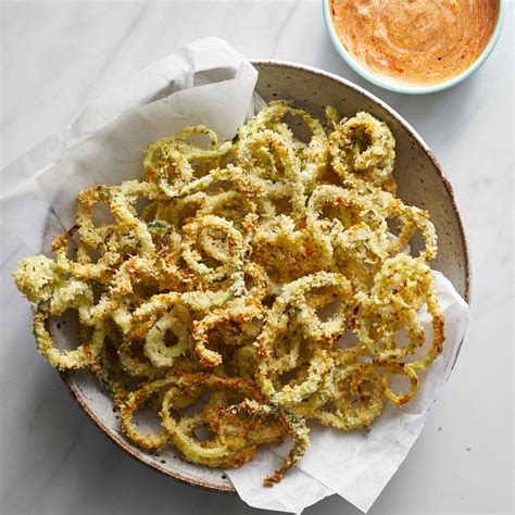 baked-parmesan-zucchini-curly-fries-recipe-eatingwell image