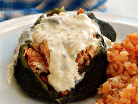 chipotle-chicken-stuffed-poblanos-with-rajas-sauce image
