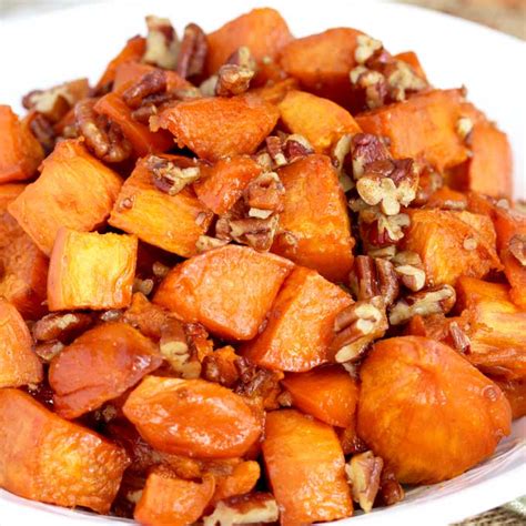 candied-sweet-potatoes-with-brown-sugar-and-pecans image