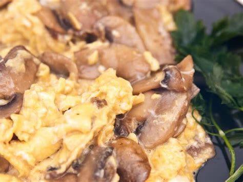 scrambled-eggs-in-mushroom-and-cheese-sauce image