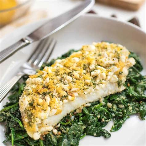 oven-baked-cod-with-lemon-and-dill-on-spinach-a-well image
