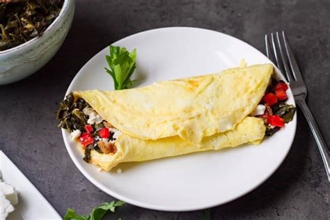 red-peppers-and-feta-collard-green-omelet-on-tys-plate image