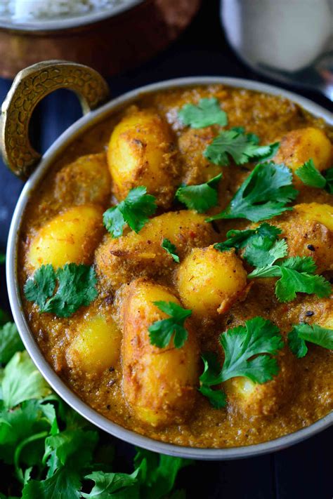 spicy-vegan-potato-curry-dum-aloo-cilantro-and image