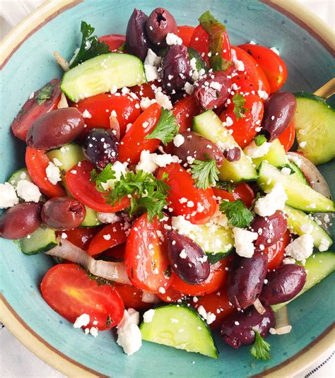 cucumber-tomato-feta-salad-with-balsamic-dressing-eatingwell image