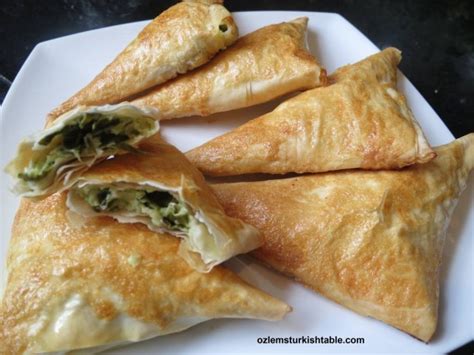 spinach-and-cheese-filled-filo-pastry-triangles-muska image