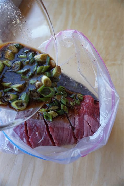 jack-daniels-marinated-flank-steak-broke-and-cooking image