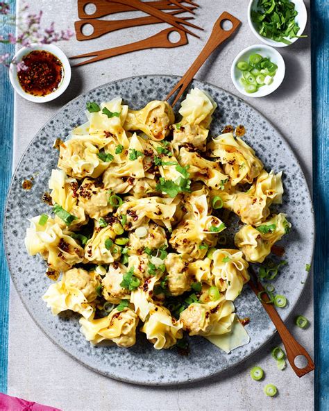 pork-celery-and-water-chestnut-wontons-with-ma-la-chilli-oil image