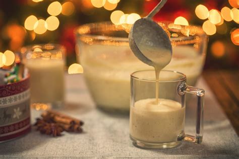 the-history-of-boozy-homemade-eggnog-southern-living image