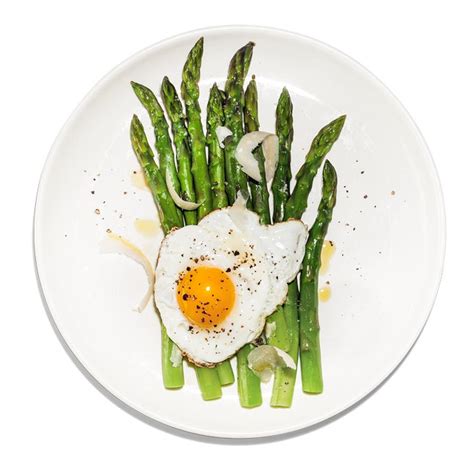asparagus-with-fried-eggs-recipe-bon-apptit image