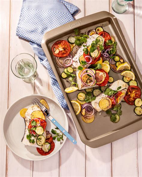 lemony-sheet-pan-fish-fillets-with-zucchini-tomatoes image