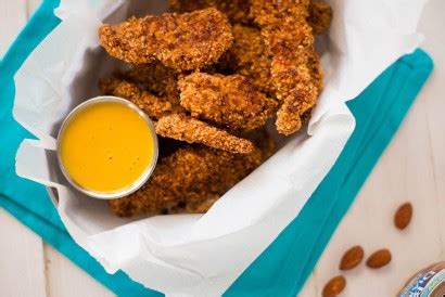 almond-crusted-baked-chicken-strips-with-honey image