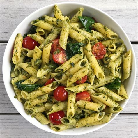 pesto-penne-with-spinach-blistered-tomatoes image