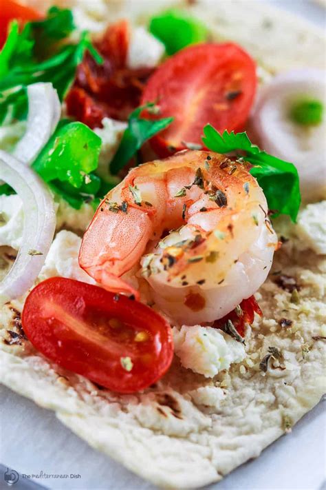 easy-mediterranean-shrimp-pizza-on-flatbread image
