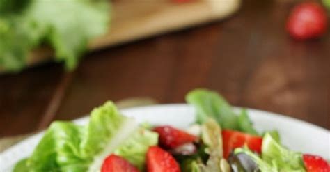 strawberry-greens-salad-with-honey-vinaigrette image