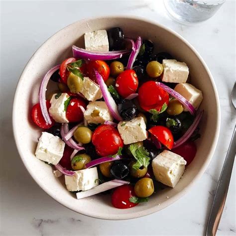 easy-olive-salad-with-feta-and-tomatoes-hint-of-healthy image