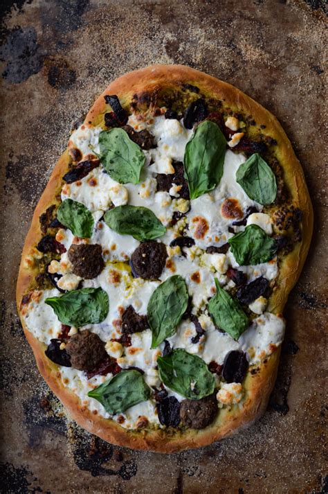 homemade-mediterranean-pizza-with-pesto-sauce-linger image